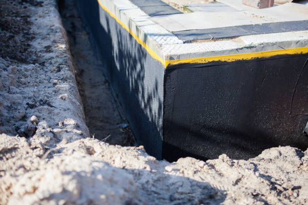 Professional Basement Waterproofing technician working in Spencerport, NY